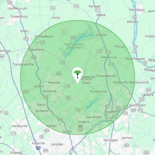 Map of The Dusting Crew service area, a shaded circle covering Bucks and Montgomery Counties from Quakertown south to Lansdale and east to Doylestown.